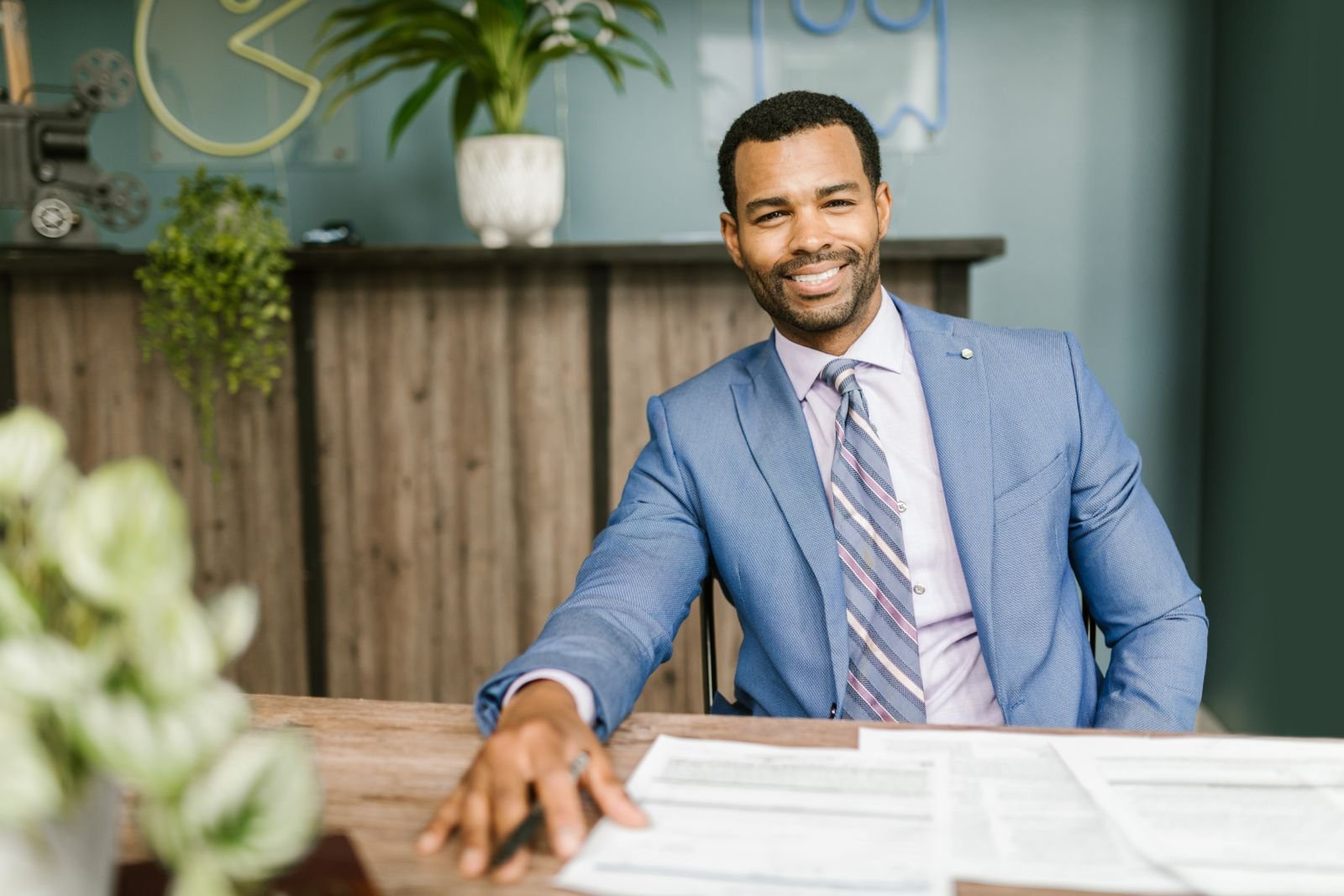 A confident agency owner presenting a proposal to a client