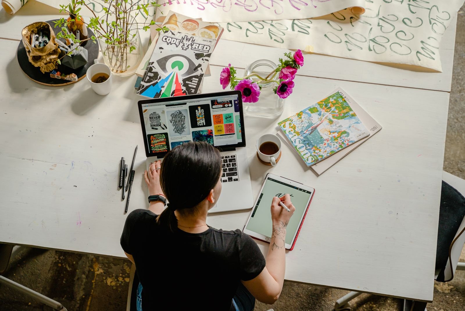 Designer planning page layouts on a tablet