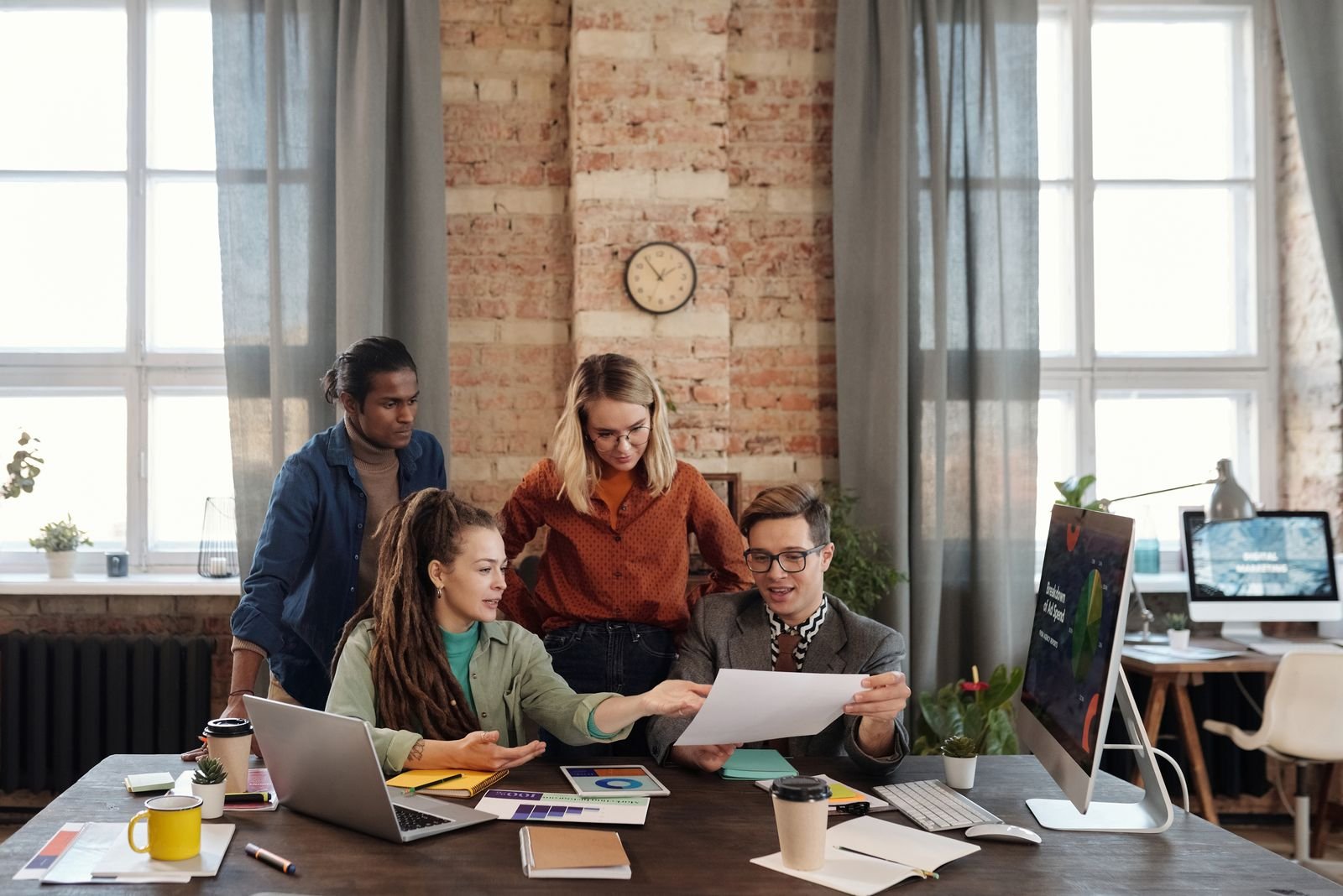 A CreatoMark team working together at a shared table