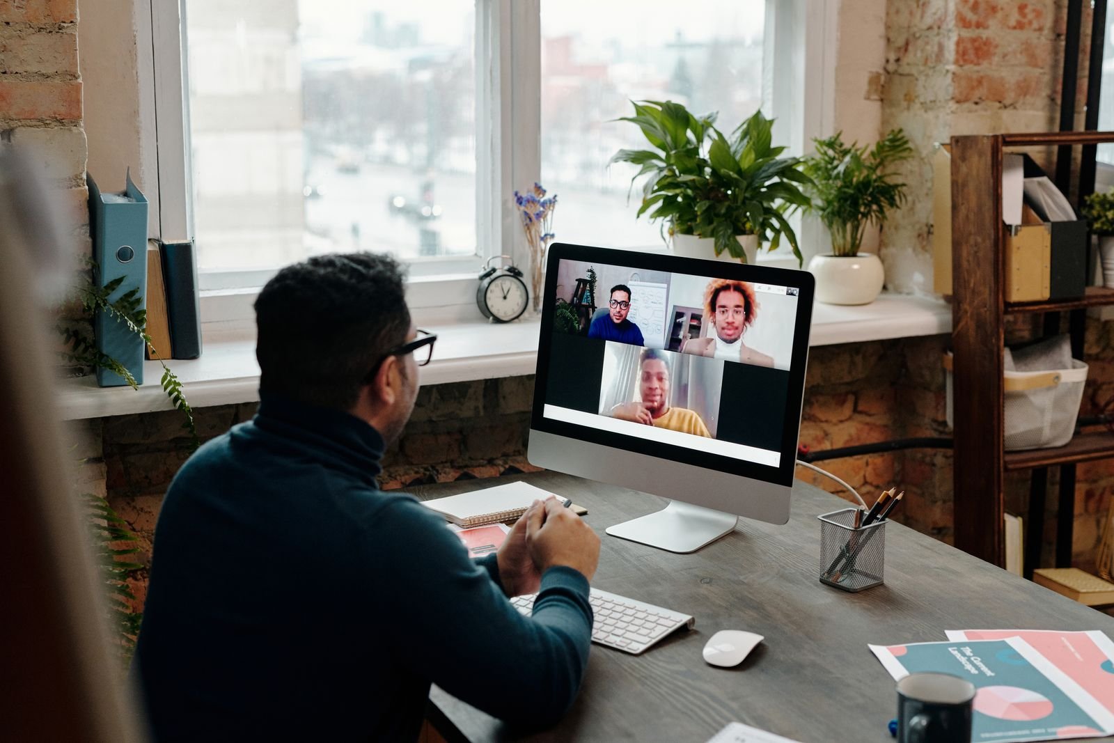 A remote team member on a video call from home