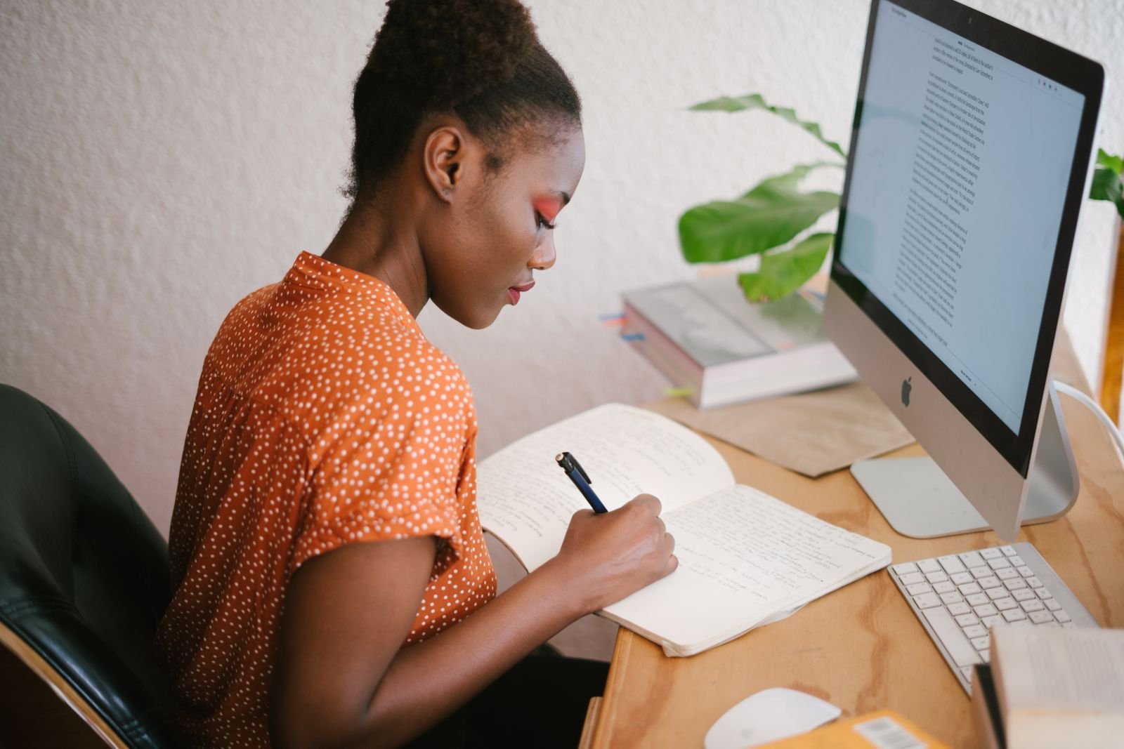 Writer drafting content at her desk