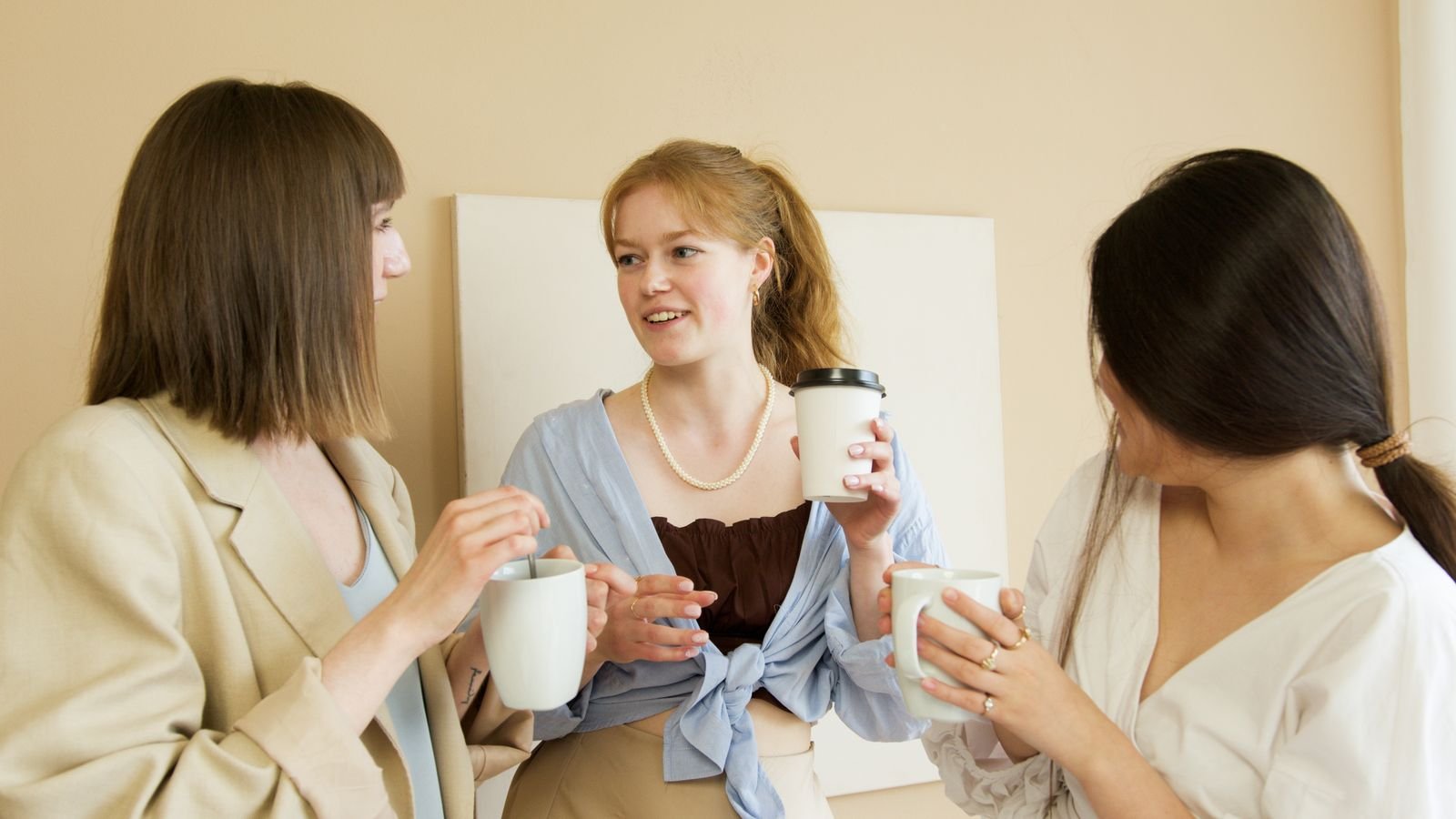 Colleagues chatting over coffee