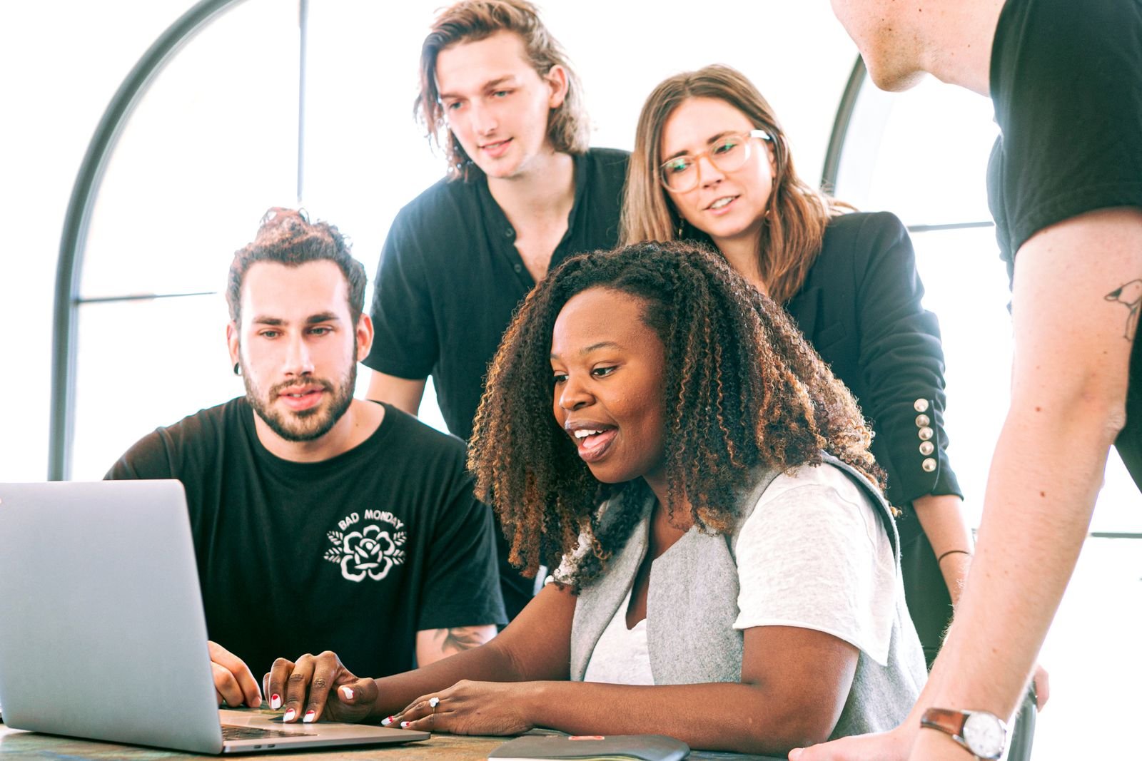 Design team reviewing a website on a laptop